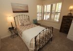 Guest bedroom offers a twin trundle bed with king conversion and linens